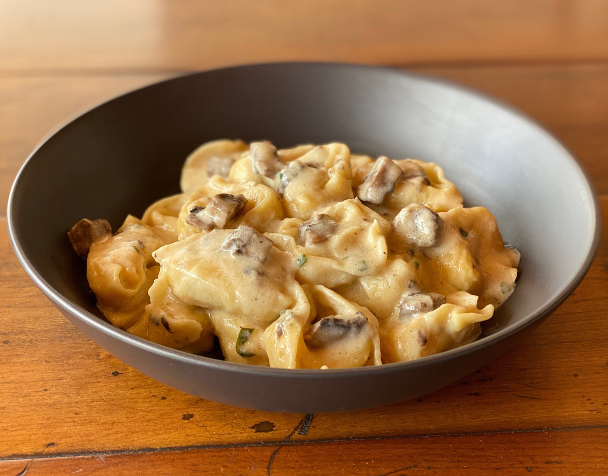 Cheese Tortelloni with White Wine & Mushroom Sauce (V)