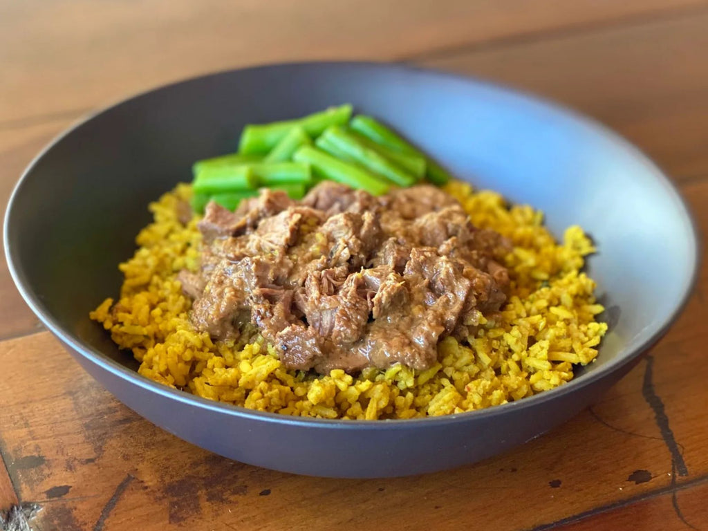 bowl of indian lamb curry with biryani