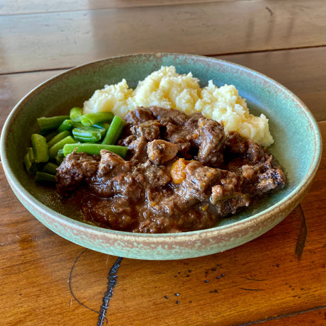 Our Beef Burgundy. Tender beef in a wine and herb sauce, served with our buttery mash and green beans.