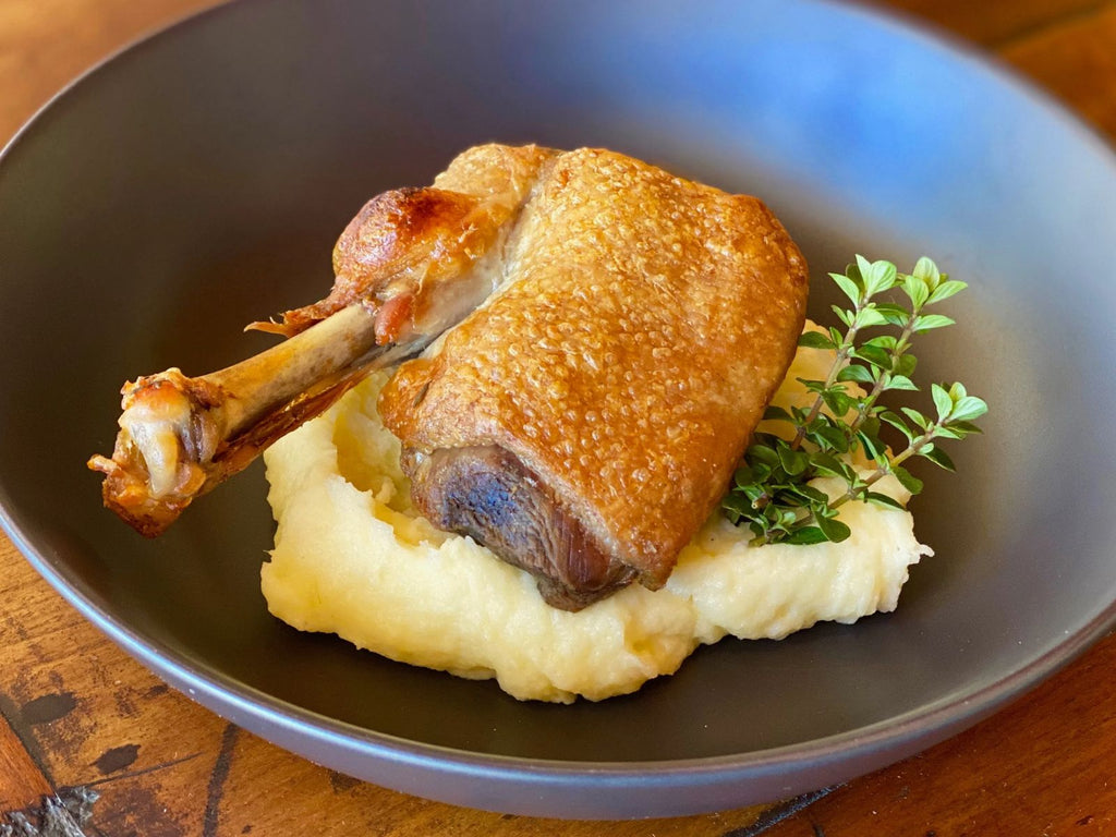 confit duck breast served on bed of mash potato