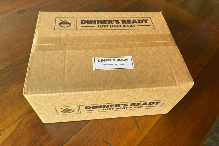 cardboard food delivery box with dinners ready stickers
