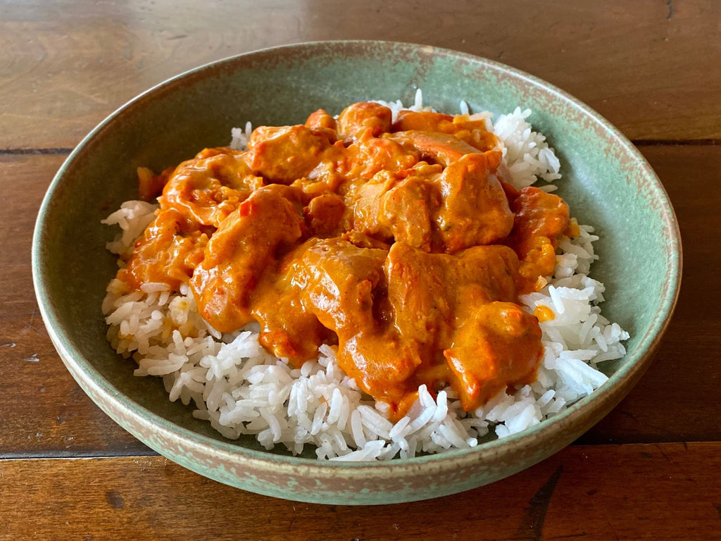 bowl of butter chicken with rice